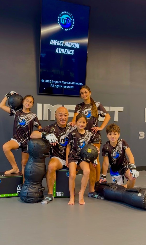 Coach Shick with his four athlete children in the training gym